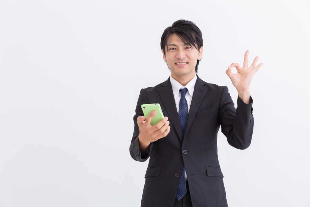 Asian,Middle,Age,Businessman,Who,Uses,Smart,Phone